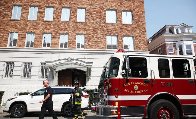 A San Francisco fire sits in front of the Russian consulate after responding to reports of a fire in the building on Friday in San Francisco, California. (AFP)