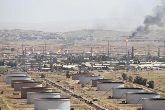 Above, flames are seen at the Baba Gurgur oil field in Kirkuk. (Reuters)