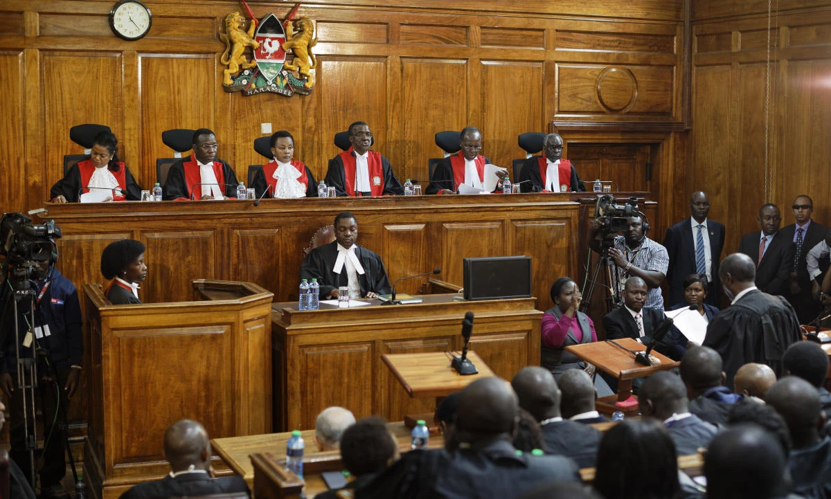 Kenyan Supreme Court judges from left, Njoki Ndung'u, Jackton Ojwang, Deputy Chief Justice Philomela Mwilu, Chief Justice David Maraga, Smokin Wanjala and Isaac Lenaola deliver the verdict on a petition challenging the presidential election result, at the Supreme Court in Nairobi, Kenya Friday, Sept. 1, 2017. Kenya's Supreme Court on Friday nullified President Uhuru Kenyatta's election win last month and called for new elections within 60 days, shocking a country that had been braced for further protests by opposition supporters. (AP)