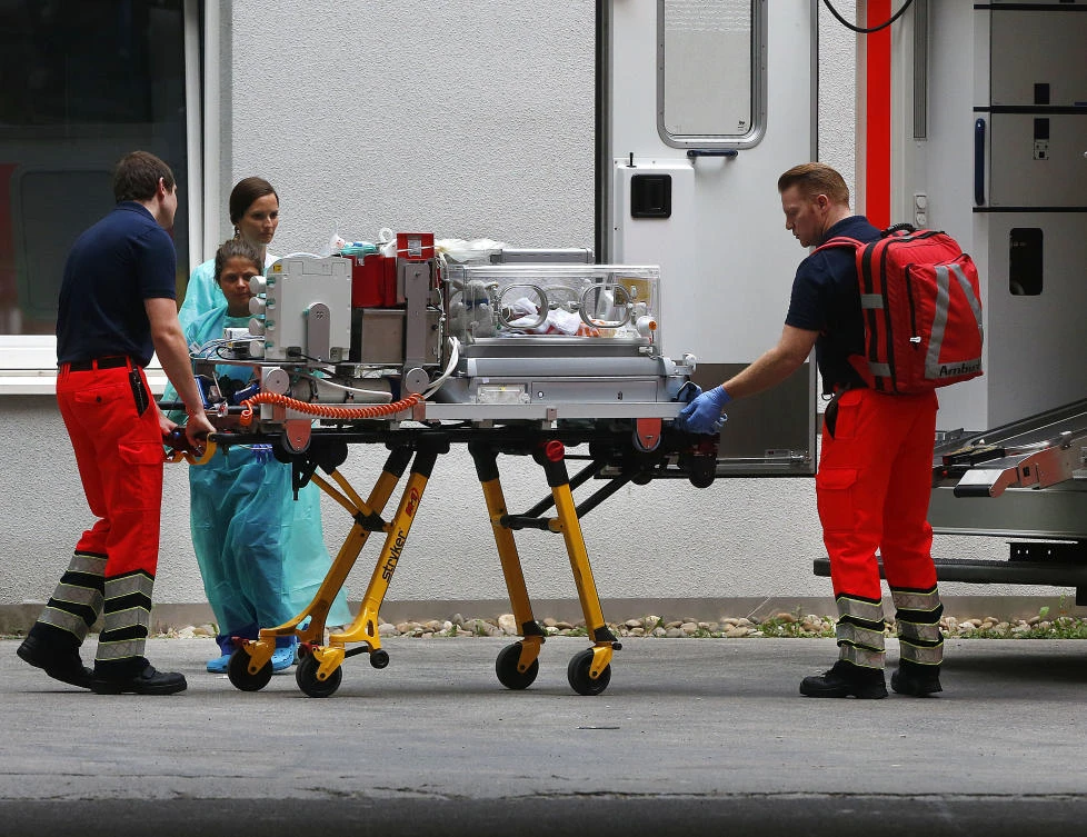 A premature infant in an incubator is taken to an ambulance to be transported from the Buergerhospital to another hospital in Frankfurt, Germany, on Friday, on September 1, 2017. (File photo by AP)