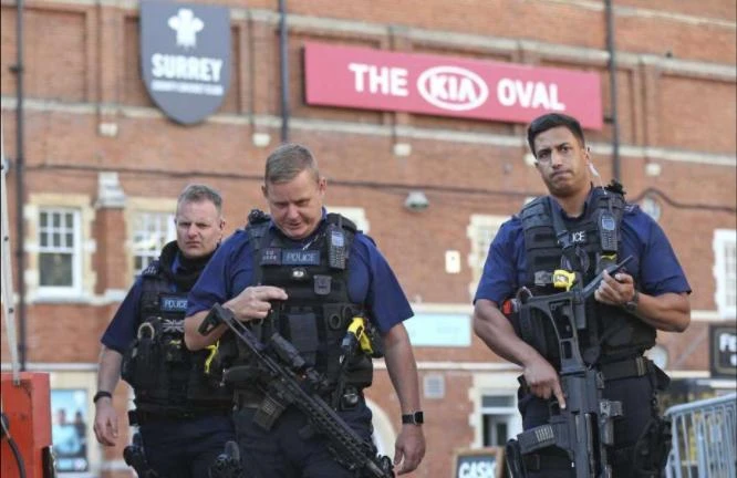 Police secure the area outside The Oval cricket ground in London, after play was suspended in the County Championship clash between Surrey and Middlesex after an arrow was fired onto the pitch on Aug. 31, 2017. AP)