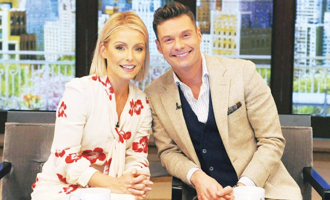 Kelly Ripa and Ryan Seacrest pose for a photo at
‘Live’ in New York. (AP)