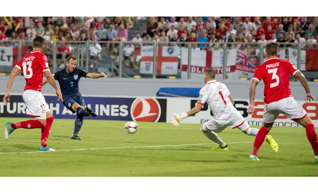 England's Harry Kane, second from left, scores his side's first goal during the World Cup group F qualifying soccer match between Malta and England at the Ta Qali stadium in Valletta, Malta, Friday. (AP)