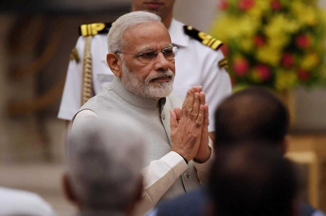 India Prime Minister Narendra Modi greets attendees during the swearing-in ceremony of new ministers at the Presidential Palace in New Delhi on September 3, 2017. (AFP)