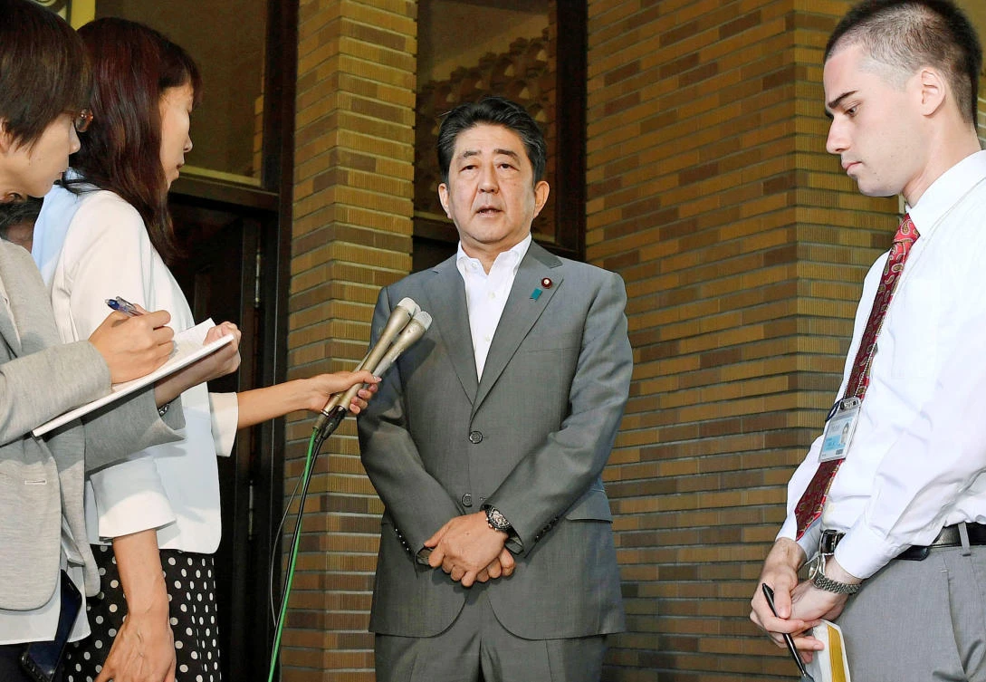 Japan’s Prime Minister Shinzo Abe speaks to reporters after having a telephone call with US President Donald Trump at the Prime Minister’s former official residence in Tokyo, Japan, on September 3, 2017. (Kyodo via Reuters)