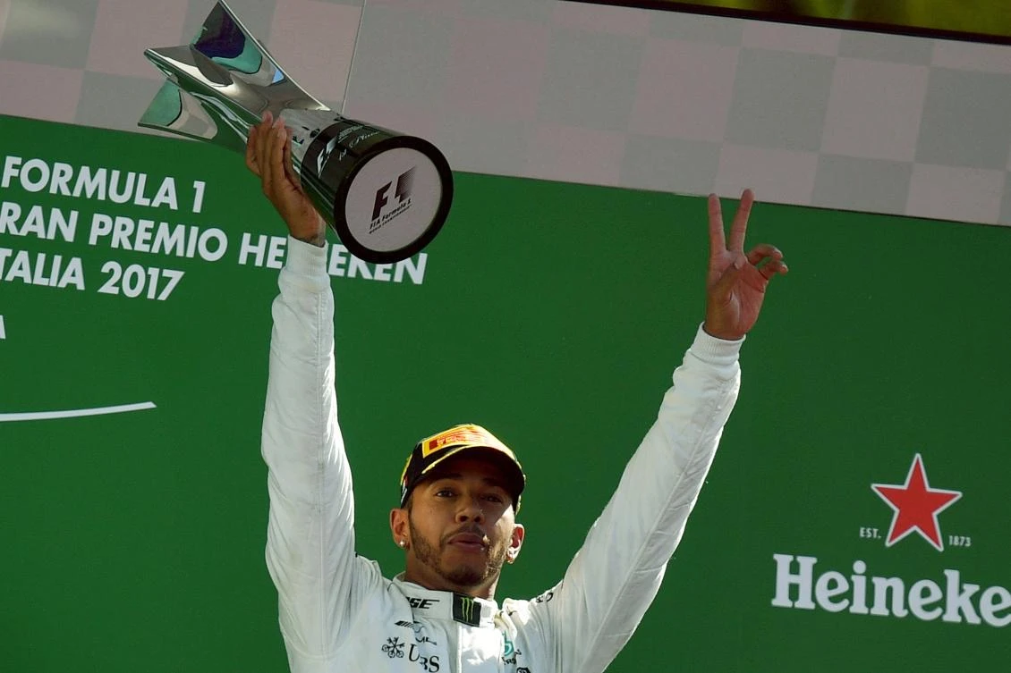 Winner Mercedes’ British driver Lewis Hamilton celebrates on the podium after the Italian Formula One Grand Prix at the Autodromo Nazionale circuit in Monza, on September 3, 2017. (AFP)