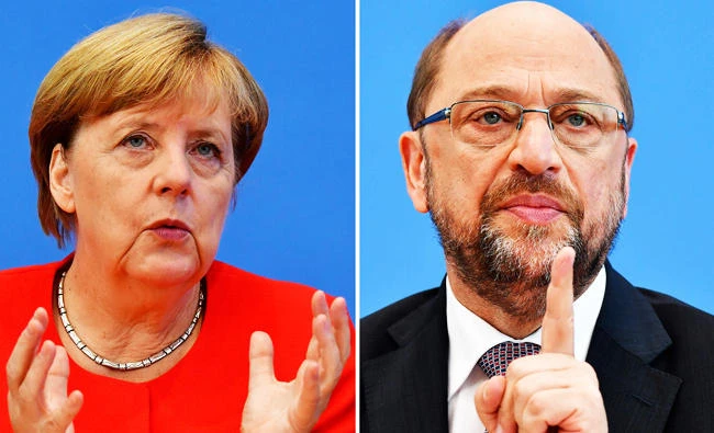 This combination created on September 1, 2017 of file photos shows German Chancellor Angela Merkel, also leader of the conservative Christian Democratic Union (CDU) party (L, on August 29, 2017 in Berlin) and Martin Schulz, leader of Germany's social democratic SPD party and candidate for Chancellor (June 27, 2017 in Berlin). (AFP)
