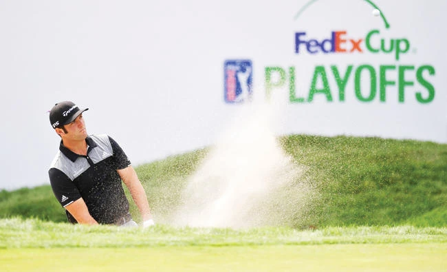 Jon Rahm of Spain plays a shot from a bunker on the 17th hole during round two of the Dell Technologies Championship at TPC Boston on Saturday in Norton, Massachusetts. (AFP)