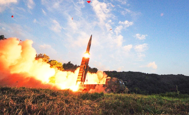 This handout photo taken on September 4, 2017 and provided by South Korean Defence Ministry in Seoul shows South Korea's missile system firing Hyunmu-2 missile into the East Sea from an undisclosed location on South Korea's east coast during a live-fire exercise simulating an attack on North Korea's nuclear site. (AFP)