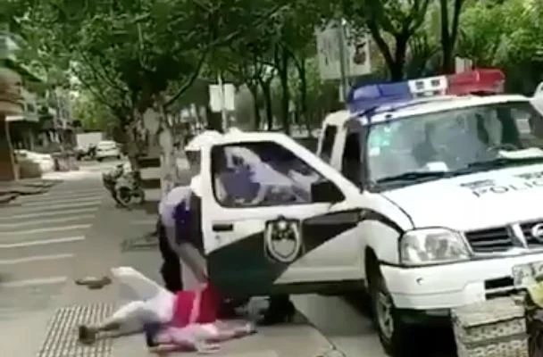 In the viral video, the policeman can be seen having a row with a woman a child. (Photo courtesy: social media)