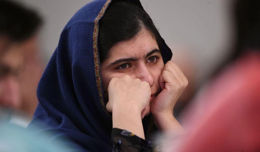 Nobel Prize winner Malala Yousafzai listens to eyewitness accounts of the Taliban attack on the Army Public School in Peshawar, Pakistan, which took place on Dec. 16, 2014, and killed 150 people, as she attends the "Poppies for Peace in Peshawar" event in Birmingham, central England, Tuesday Dec. 15, 2015. The 18-year-old said comments such as those by controversial United States presidential hopeful Donald Trump could "radicalize more terrorists" and urged politicians to think carefully before speaking. (AP)