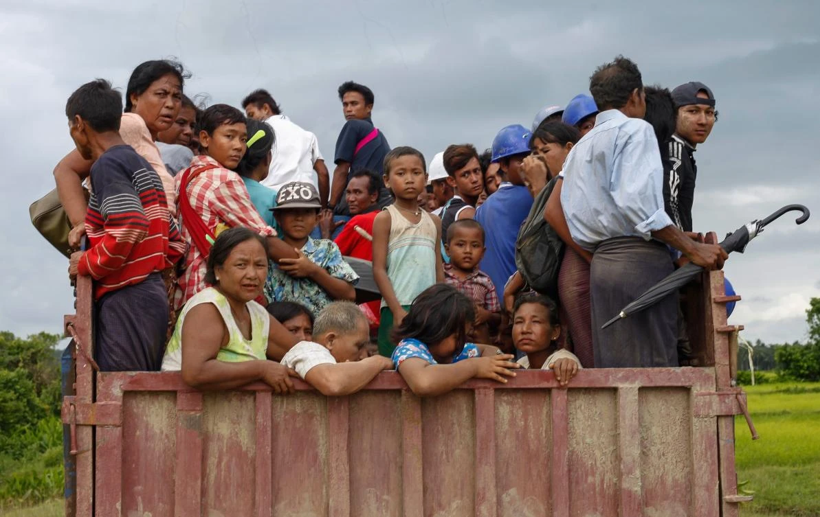 This picture taken on August 25, 2017 shows ethnic Rakhine people fleeing from a conflict area at the Yathae Taung township in Rakhine State in Myanmar. The impoverished western state of Rakhine neighbouring Bangladesh has become a crucible of religious hatred focused on the stateless Rohingya Muslim minority, who are reviled and perceived as illegal immigrants in Buddhist-majority Myanmar. (AFP)