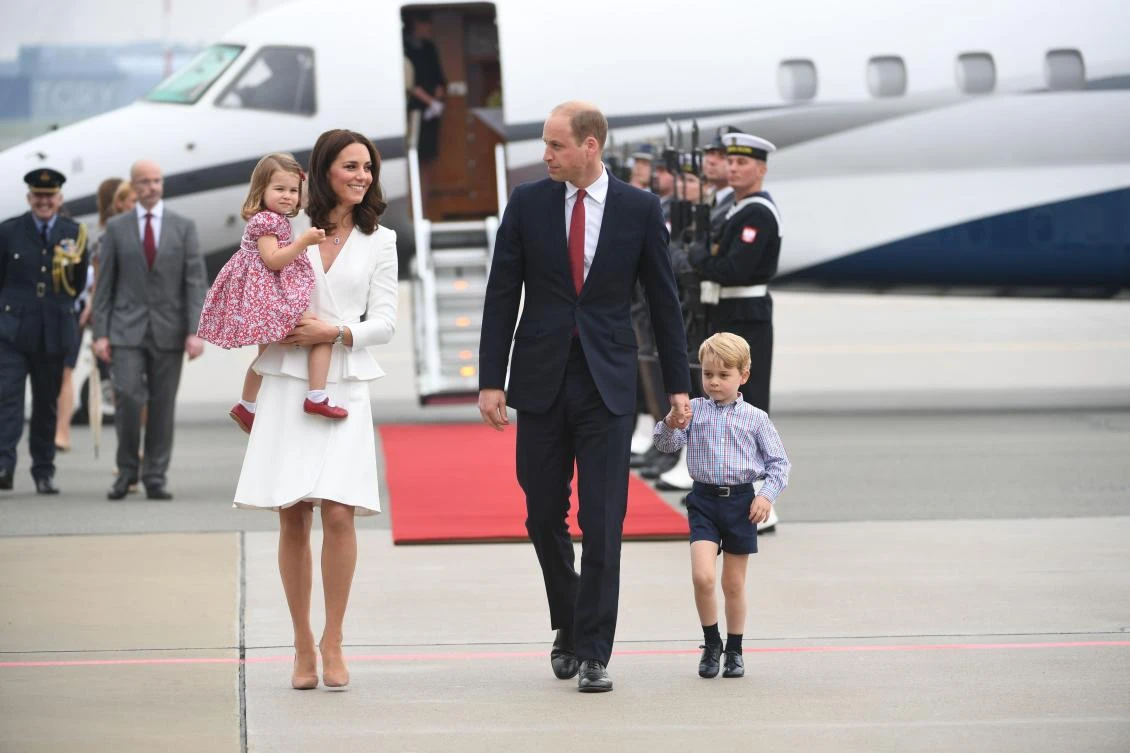 This file photo taken on July 17, 2017 shows Britain's Prince William, Duke of Cambridge (R) and his wife Kate, Duchess of Cambridge (L) with their children Prince George and Princess Charlotte arriving at the airport in Warsaw, Poland. Prince William and his wife Kate are expecting their third child, Kensington Palace announced on September 4, 2017, adding that she would not be attending a planned engagement due to a severe form of morning sickness.(AFP)