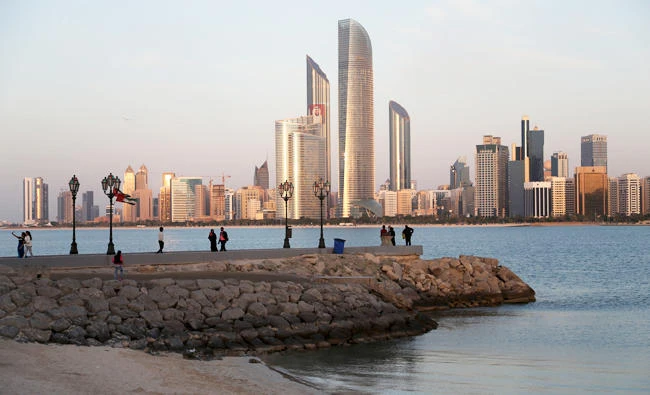 With the city skyline in backdrop, people of different nationalities enjoy a good weather of 24 degrees Celsius in Abu Dhabi, United Arab Emirates, in this file photo. (AP)