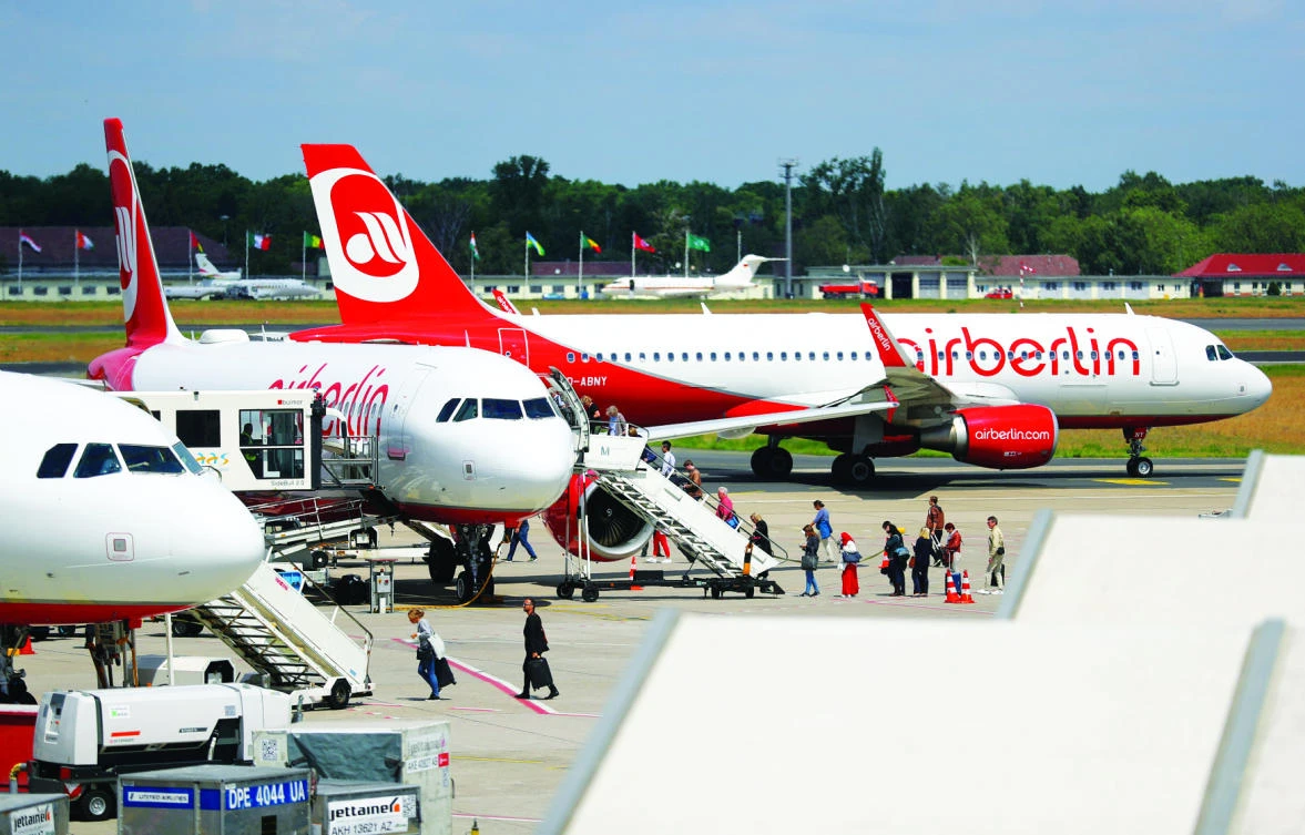 Passengers board an Air Berlin aircraft at Tegel airport in Berlin. Businessman Alexander Skora has emerged
as a potential bidder for the carrier. (Reuters)