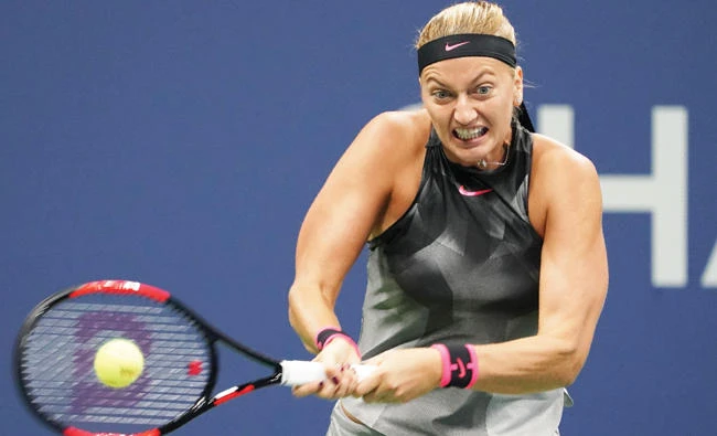Petra Kvitova of the Czech Republic hits a return to Garbine Muguruza of Spain during their 2017 US Open match at the USTA Billie Jean King National Tennis Center in New York on Sunday. (AFP)