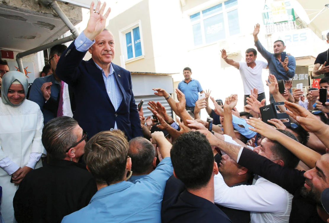 Turkish President Recep Tayyip Erdogan greets his supporters in Catalca near Istanbul, Monday. (Reuters)