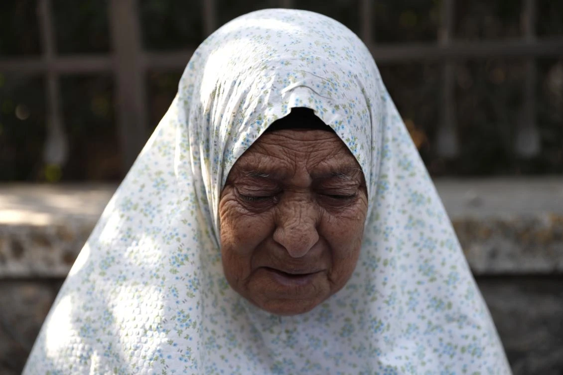 Palestinian Fahamiya Shamasneh, 75, cries as Israeli policemen evict her from her family home, in which they lived for over half a century, in the Arab neighbourhood of Sheikh Jarrah in east Jerusalem, on September 5, 2017, making way for Israelis deemed the legal occupants. The Shamasneh family has for years been fighting a court battle against Jewish claimants who said that the building was their family property, which they fled when east Jerusalem was occupied by Jordanian troops in the 1948 war that led to the creation of the Jewish state. Under Israeli law, if Jews can prove their families lived in east Jerusalem homes before the 1948 war they can demand that Israel's general custodian office release the property and return their "ownership rights". / AFP / Ahmad GHARABLI