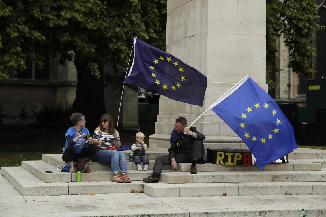 Pro-remain supporters of Britain staying in the EU, take part in a protest to coincide with politicians returning to work after the summer recess, outside the Houses of Parliament in London, Tuesday, Sept. 5, 2017. (AP)