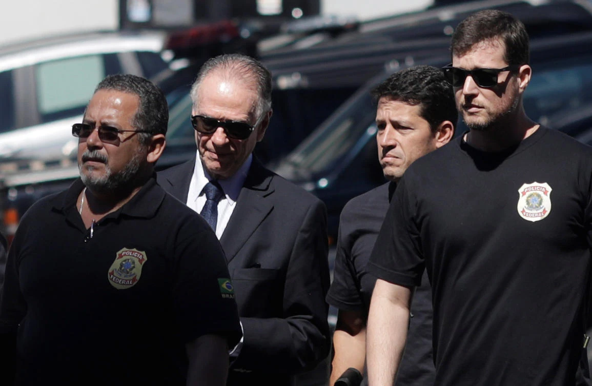 Brazilian Olympic Committee (COB) President Carlos Arthur Nuzman (2nd L) arrives to Federal Police headquarters in Rio de Janeiro, Brazil, September 5, 2017. (Reuters)