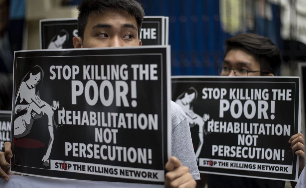 Activists hold a protest in front of the Department of Justice (DOJ) building in Manila. (AFP)
