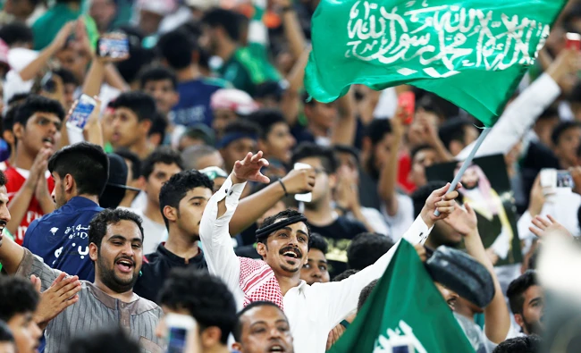ans of of Saudi Arabia cheer and chant before the start of their soccer match against Japan on Tuesday. (REUTERS/Faisal Al Nasser)