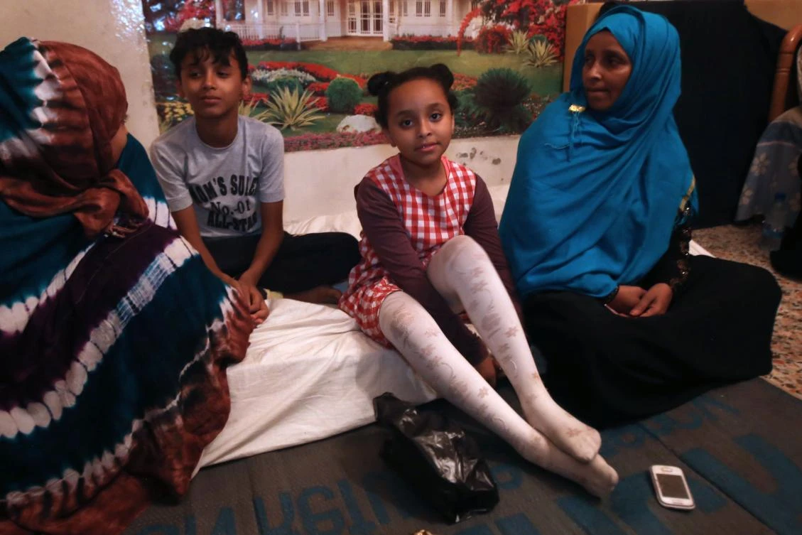 Zahraa Abdi (R), 47, who fled her native Somalia in 2012 with her three children, sits with her children inside a shared apartment in the Barzeh district of the Syrian capital Damascus, on August 12, 2017. Millions of Syrians have fled their country's war as refugees, but for tens of thousands of people escaping conflict elsewhere, Syria is also a place of refuge. The UN's refugee agency UNHCR estimates some 55,000 refugees from war-torn countries in the Middle East and beyond are currently living in Syria, which has been ravaged by conflict since March 2011. (AFP)