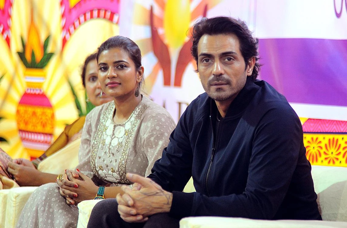 Indian Bollywood actor Arjun Rampal (R) and South Indian actress Aishwarya Rajesh (L) take part in a promotional event for the political crime drama Hindi film ‘Daddy’ in Mumbai on August 4, 2017 . (AFP)