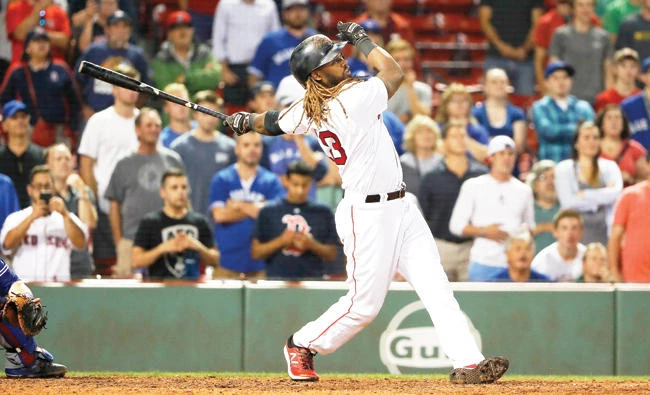 Boston Red Sox’s Hanley Ramirez watches his single that drove in the winning run in the 19th inning against the Toronto Blue Jays in a baseball game at Fenway Park in Boston early Wednesday. Boston won 3-2. (AP)