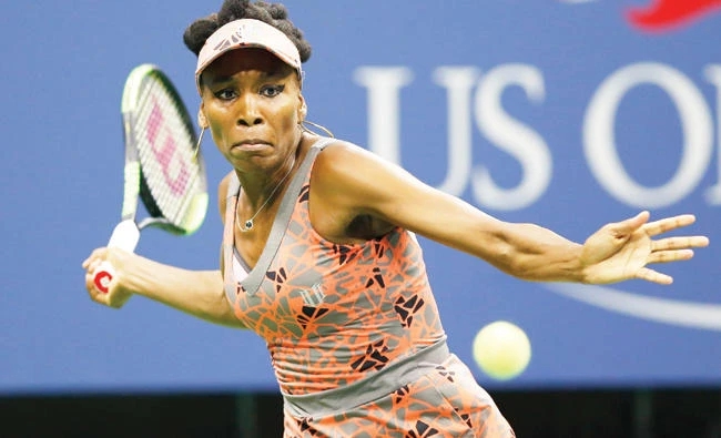Venus Williams, of the US, prepares to hit a forehand to Petra Kvitova, of the Czech Republic, during the quarterfinals at the US Open tennis tournament in New York Tuesday. (AP)