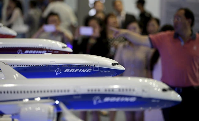 Visitors look at models of Boeing aircrafts at the Aviation Expo China 2015, in Beijing, China, in this September 16, 2015 file photo. (REUTERS)