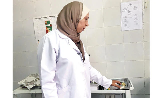 A doctor displays contraceptives at a family planning clinic in Cairo. (Reuters)