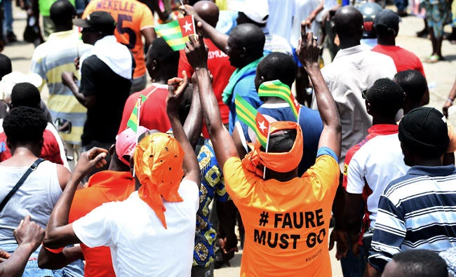 A protester wears a T-shirt with the inscription "Faure Must Go" as at an anti-government rally in Lome on Wednesday. (AFP)