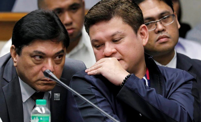 Paolo Duterte, Davao's vice mayor and son of President Rodrigo Duterte, talks to his lawyer during a Senate hearing on drug smuggling in Pasay, Metro Manila, Philippines, on September 7, 2017. (REUTERS/Erik De Castro)