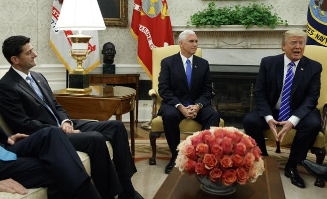 House Speaker Paul Ryan, left, and Vice President Mike Pence, center, listen as President Donald Trump speaks during a meeting with Congressional leaders in the Oval Office of the White House on Wednesday, Sept. 6, 2017, in Washington. (AP Photo/Evan Vucci)