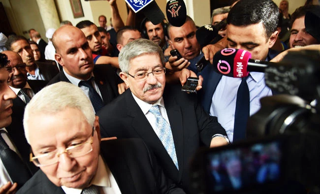 Newly appointed Algerian Prime Minister Ahmed Ouyahia (C) arrives for a congress session in the capital Algiers, in this September 4, 2017 photo. (AFP)