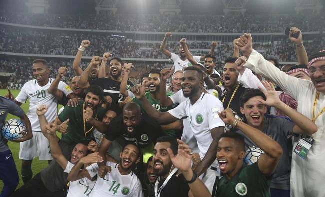 Saudi Arabia players celebrate after winning the 2018 World Cup group B qualifying soccer match between Saudi Arabia and Japan in Jeddah on Sept. 5, 2017. (AP Photo)