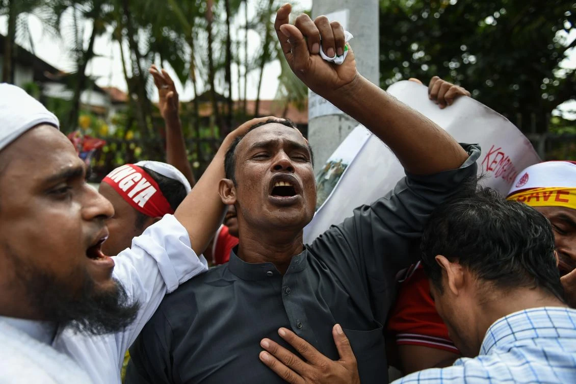 Rohingya refugees living in Malaysia shout slogans during a protest against the treatment of Rohingya Muslims in Myanmar. (AFP)
