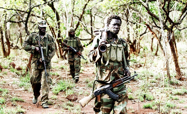 Ugandan soldiers walk at a forest bordering Central African Republic (CAR), South Sudan and Democratic Republic of Congo, near river Chinko, in this April 18, 2012 file photo. (REUTERS)
