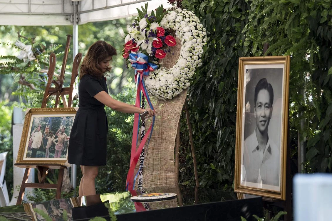 Imee Marcos, daughter of former Philippine president and late dictator Ferdinand Marcos, adjusts a wreath at the tomb her father on National Heroes' Day at the Heroes Cemetery in Manila on August 28, 2017. National Heroes Day commemorates the beginning of the "Cry of Pugad Lawin", the fight for independence from Spain by Filipino revolutionaries led by Andres Bonifacio. (AFP)