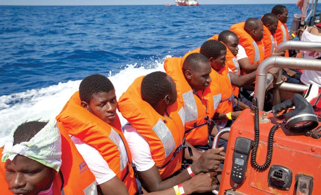 African migrants who were rescued the previous day are transferred to another ship that will take them to Europe in the Mediterranean Sea, off Libyan coast, Monday. (AP)