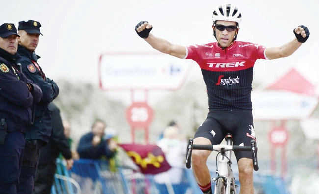 Trek Segafredo’s Spanish cyclist Alberto Contador celebrates as he crosses the finish line to win the 20th stage of the La Vuelta Tour of Spain cycling race on Saturday. (AFP)
