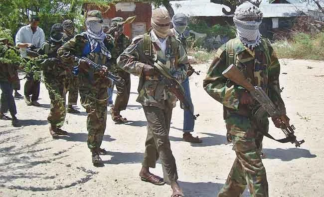 A file photo taken on March 5, 2012 shows Al-Qaeda linked al-Shebab recruits walking down a street in the Deniile district of the Somalian capital, Mogadishu, following their graduation. (AFP)