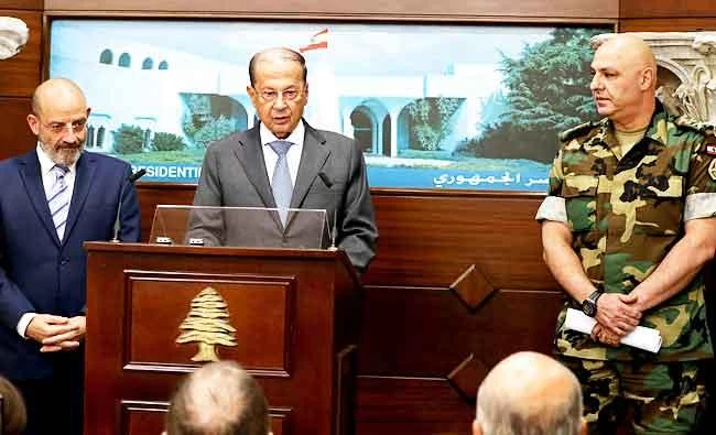 In this photo released by Lebanon's official government photographer Dalati Nohra, Lebanese Army Commander Gen. Joseph Aoun, right, and Spanish Defense Minister Yacoub Sarraf, left, listen to Lebanese President Michel Aoun, speaking to journalists at the Presidential Palace in Baabda, east of Beirut, Lebanon, in this Aug. 30, 2017 photo. (AP)