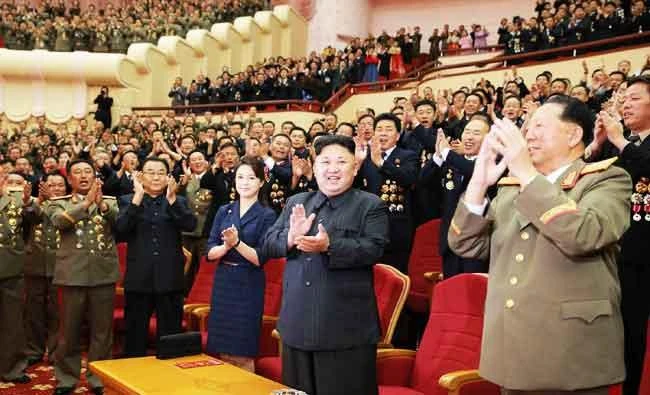 This undated photo released by North Korea's official Korean Central News Agency (KCNA) on Sunday shows North Korean leader Kim Jong-Un (front 2nd R) and his wife Ri Sol-Ju (front C) attending an art performance dedicated to nuclear scientists and technicians, who worked on a hydrogen bomb which the regime claimed to have successfully tested, at the People's Theatre in Pyongyang. (AFP)