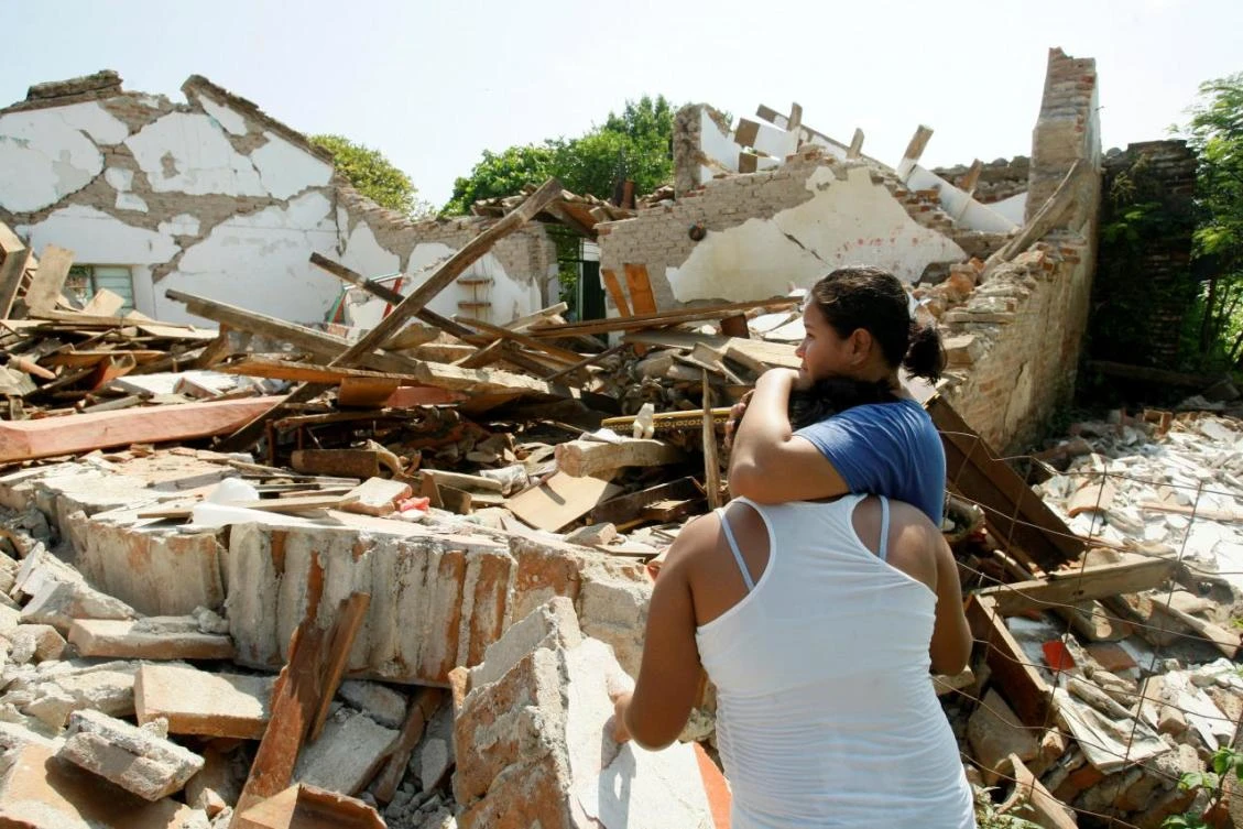 Women hug while standing next to a destroyed house after an earthquake struck the southern coast of Mexico late on Thursday, in Union Hidalgo, Mexico September 9, 2017. (REUTERS)