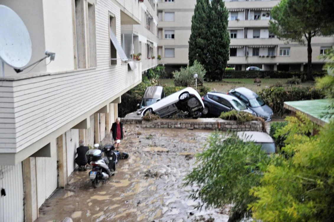 Cars that were taken with by floods sit in a ground floor in Livorno, Italy, on September 10, 2017. According to reports, five people were found dead in a flooded basement after abundant rain. (EPA/ALESSIO NOVI)