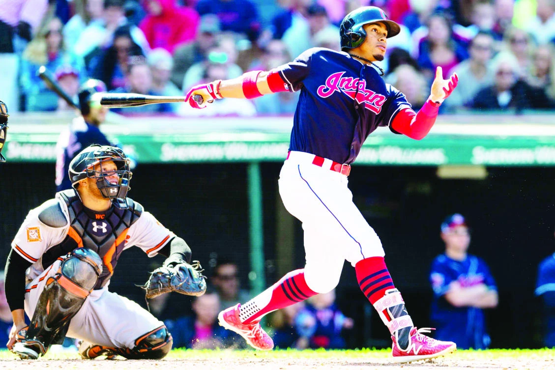 Francisco Lindor of the Cleveland Indians hits a solo home run during the seventh inning against the Baltimore Orioles at Progressive Field on Saturday in Cleveland, Ohio. (AFP)