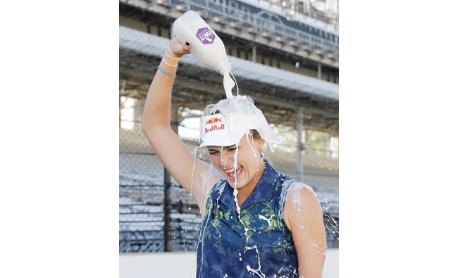Lexi Thompson pours milk over her head after winning the Indy Women in Tech Championship golf tournament Saturday in Indianapolis. (AP)