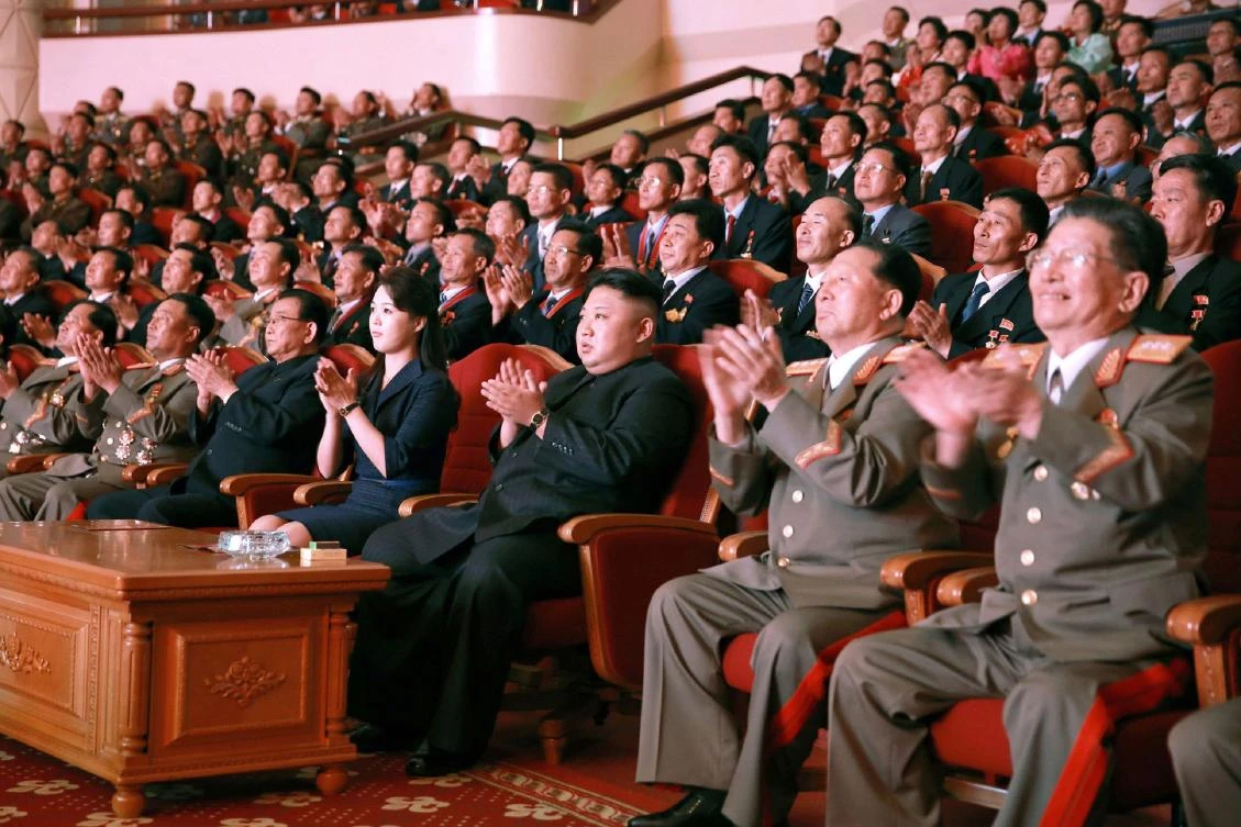 North Korean leader Kim Jong-Un (front C) and his wife Ri Sol-Ju (front 4th L) attending an art performance. (AFP/KCNA VIA KNS)
